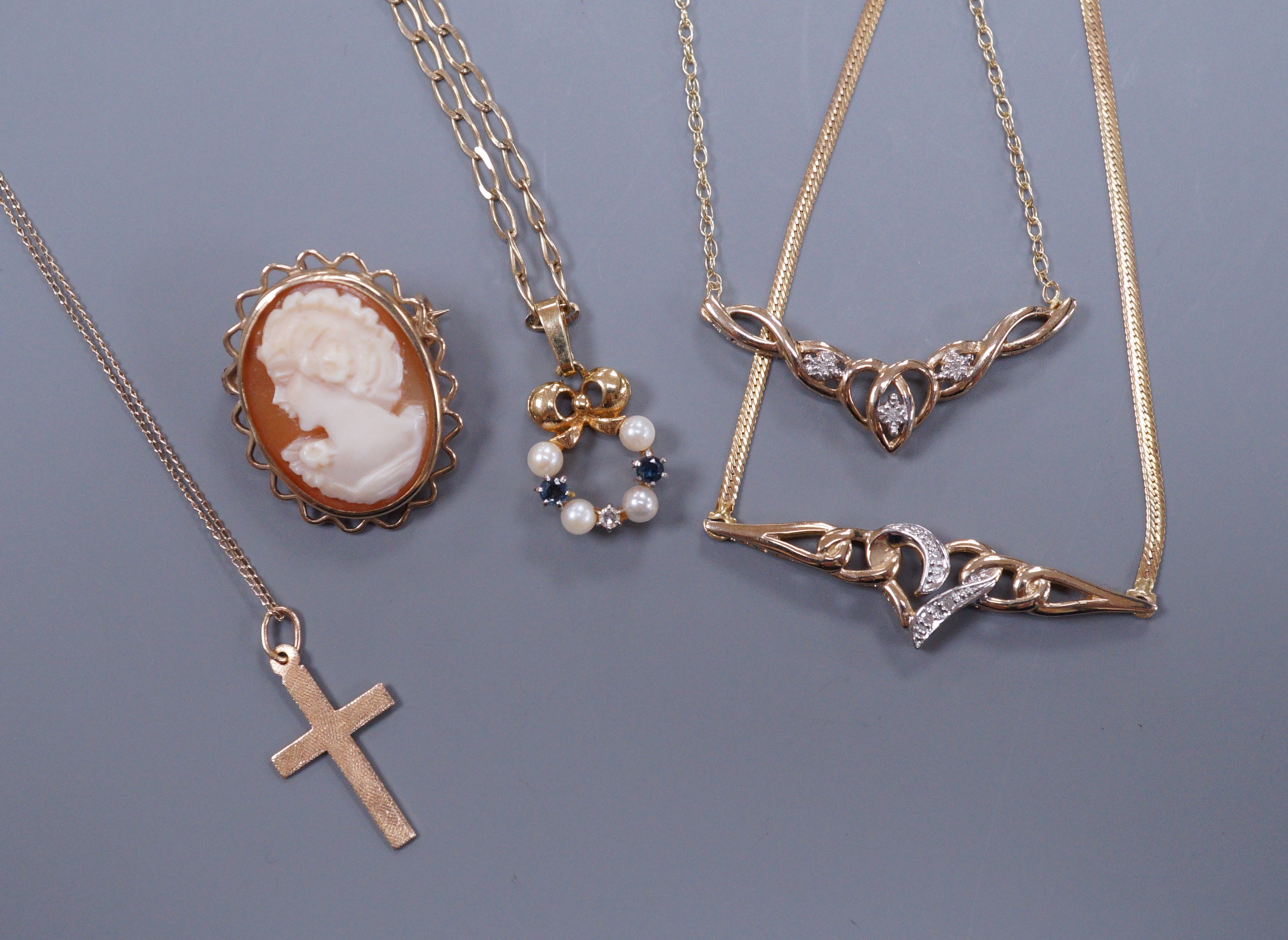 A 9ct gold diamond chip set necklace and matching bracelet, a cross pendant, a sapphire diamond and pearl pendant and a small cameo brooch, gross 11 grams